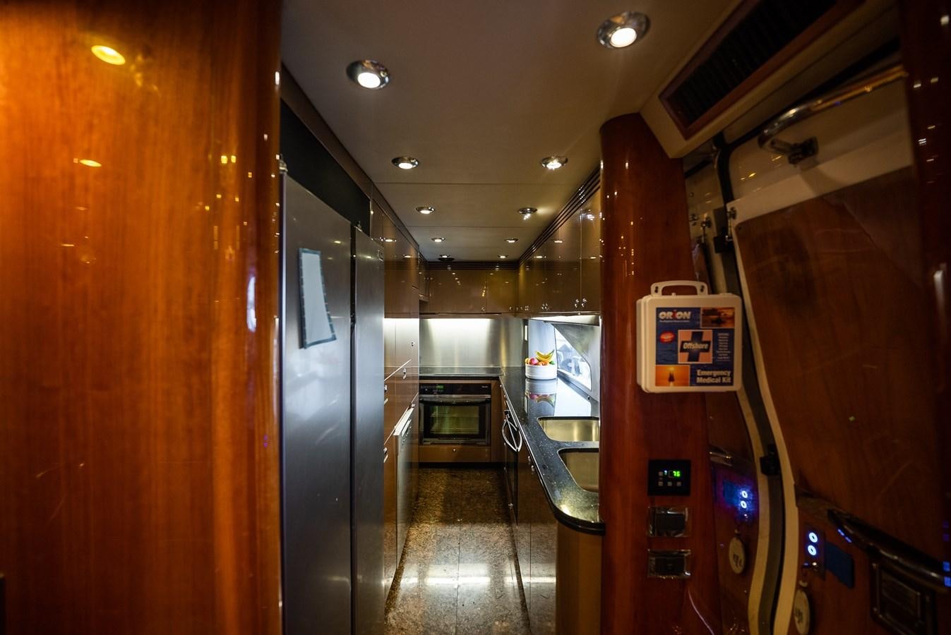 a hallway with a door and a machine in it aboard 105 MOTOR Yacht for Sale