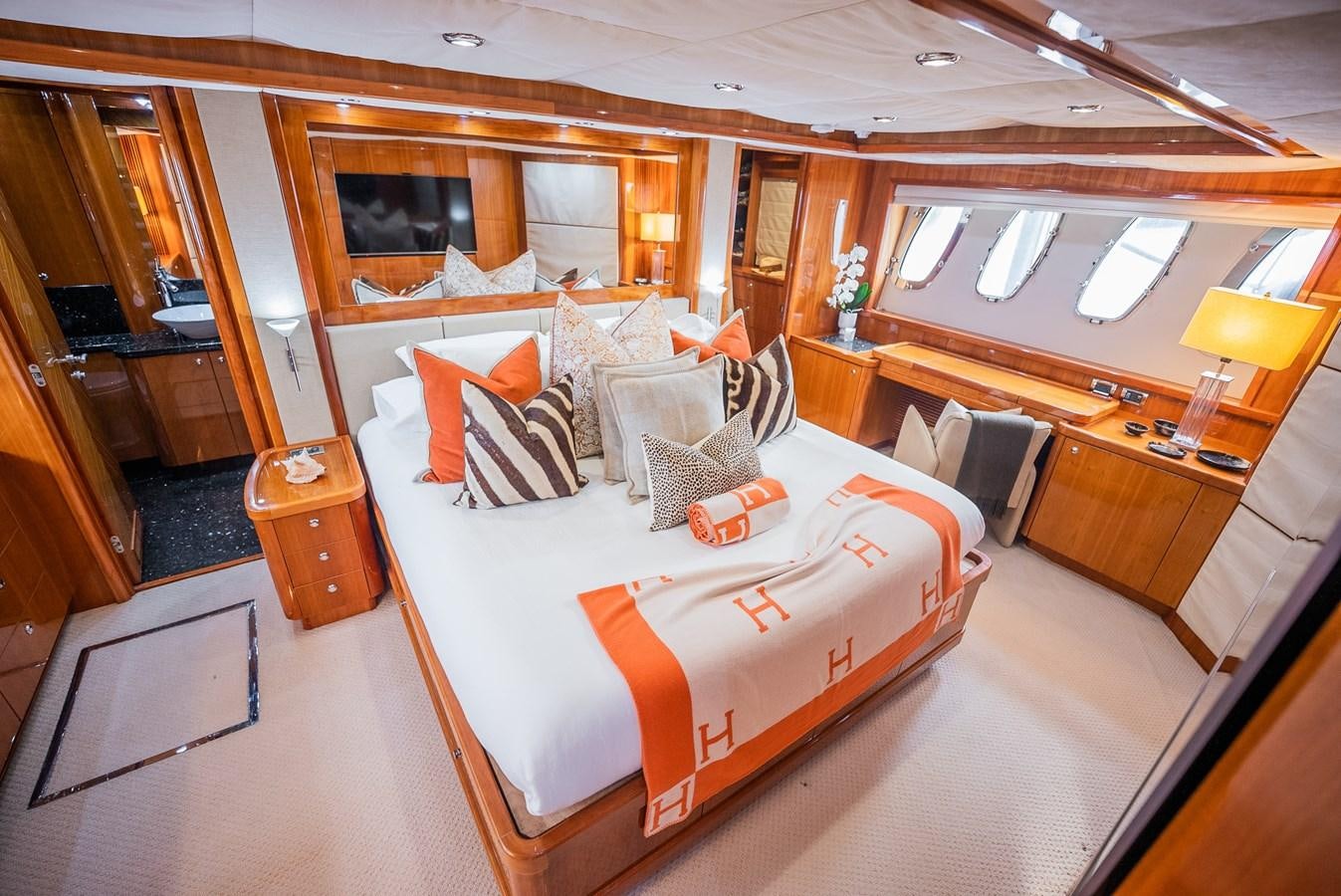 a large bedroom with a large bed aboard 105 MOTOR Yacht for Sale