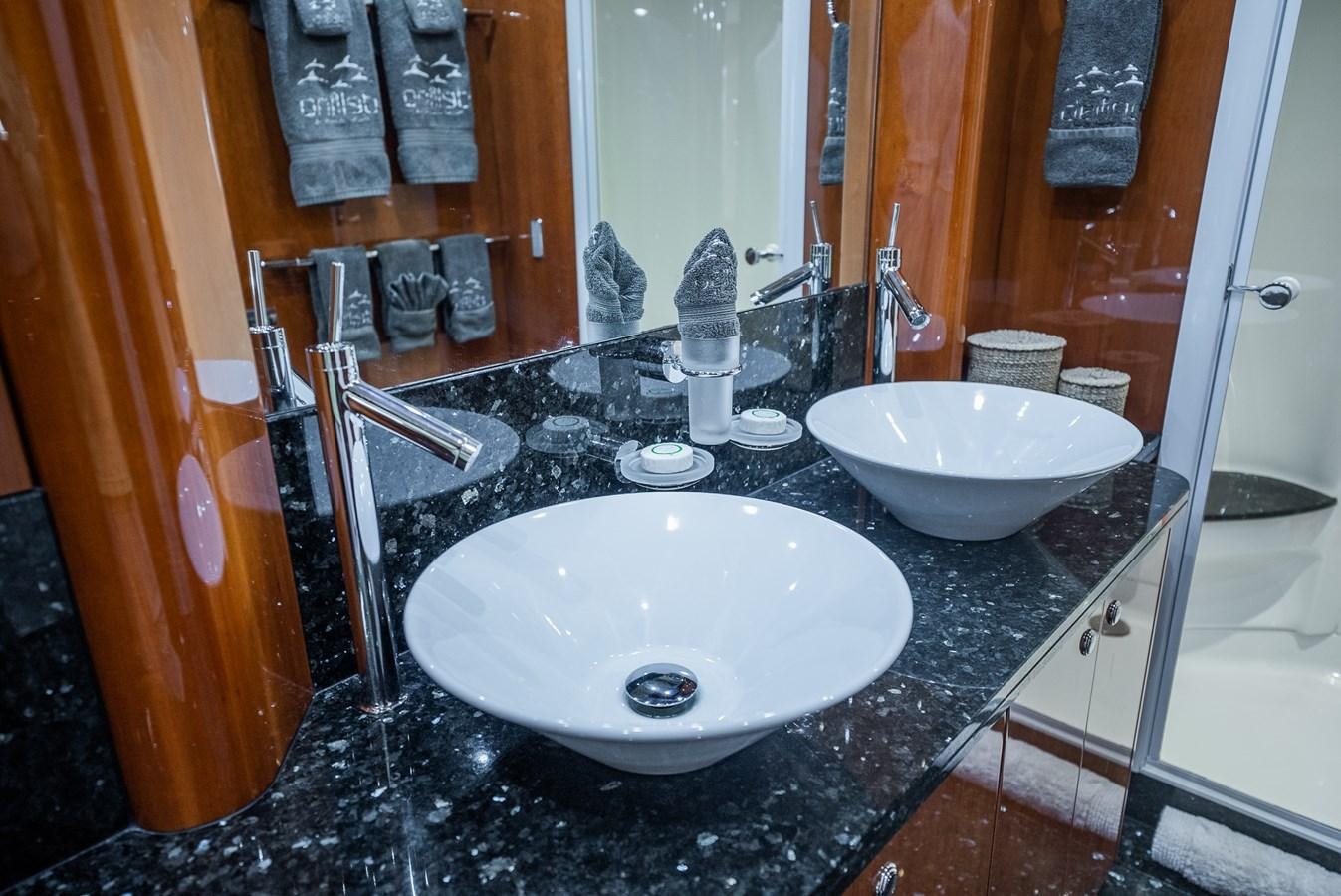 a bathroom with two sinks aboard 105 MOTOR Yacht for Sale