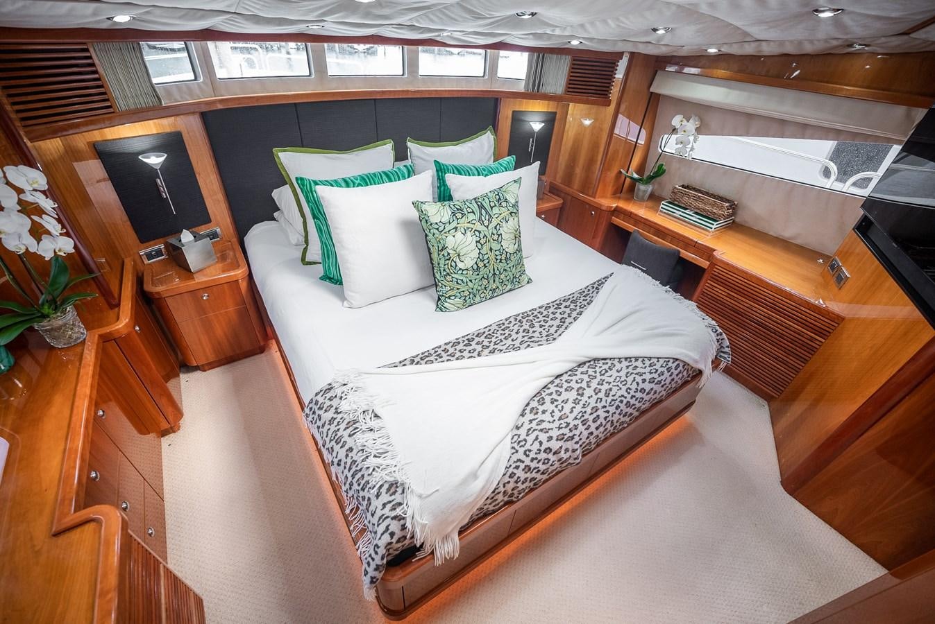 a bed with pillows aboard 105 MOTOR Yacht for Sale