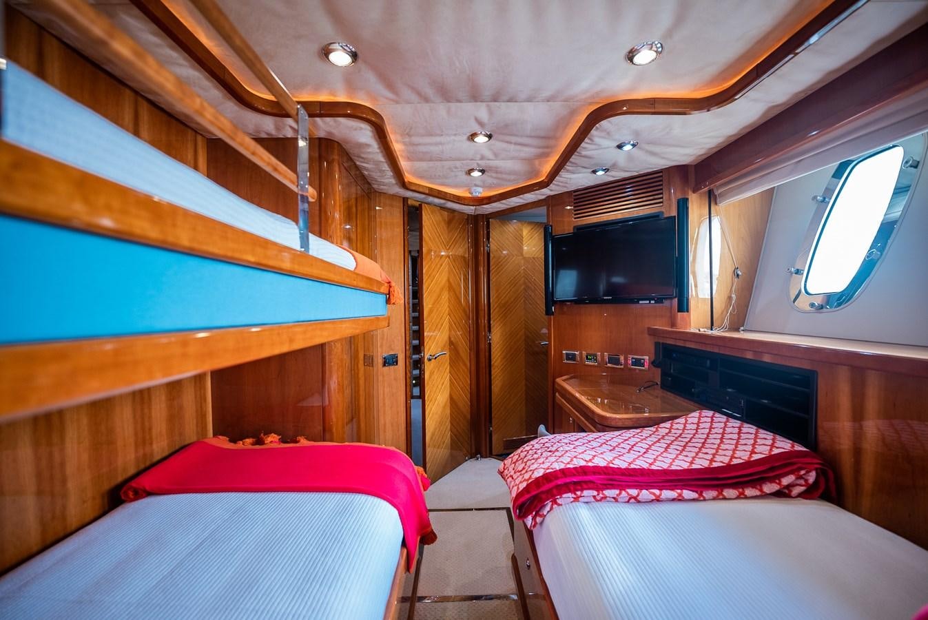 a cabin with beds aboard 105 MOTOR Yacht for Sale