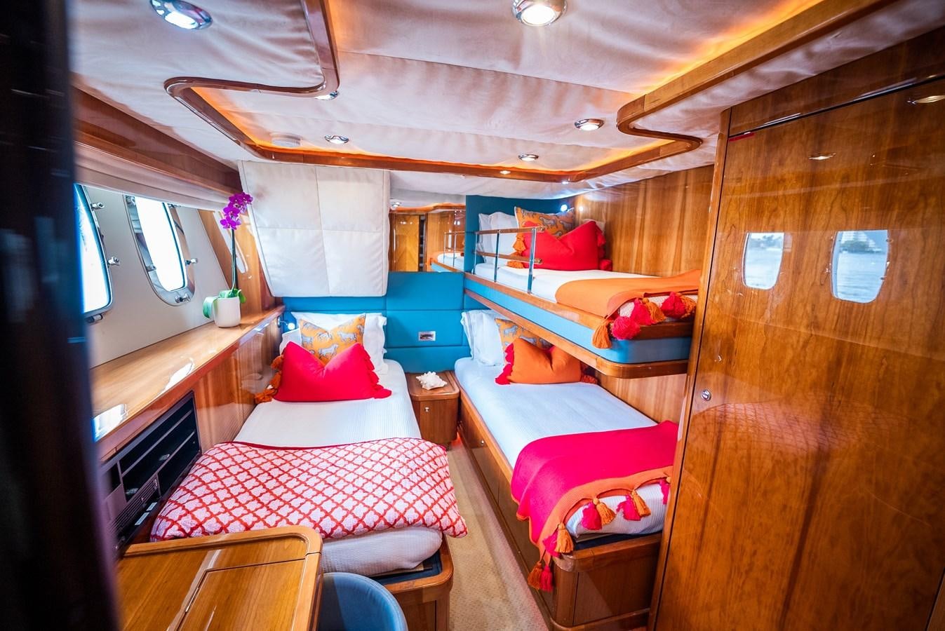 a small cabin with a bed and a table aboard 105 MOTOR Yacht for Sale