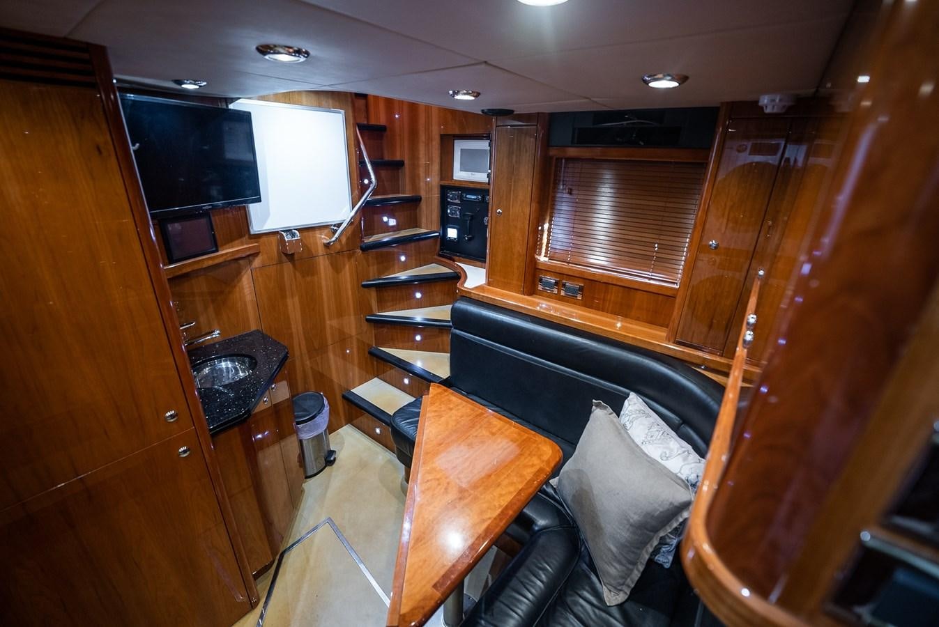a room with a couch and a television aboard 105 MOTOR Yacht for Sale