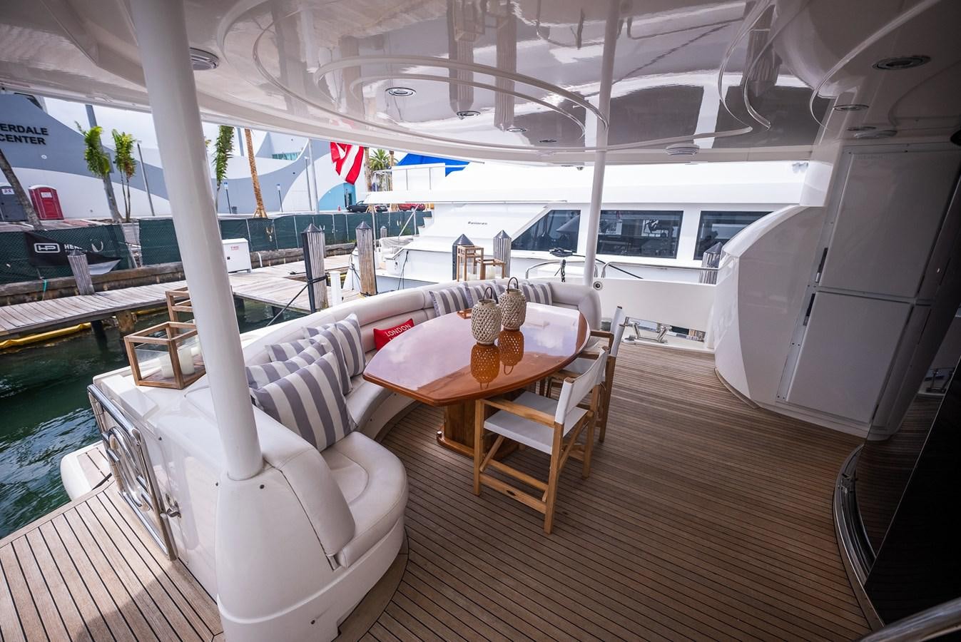 a room with a table and chairs aboard 105 MOTOR Yacht for Sale