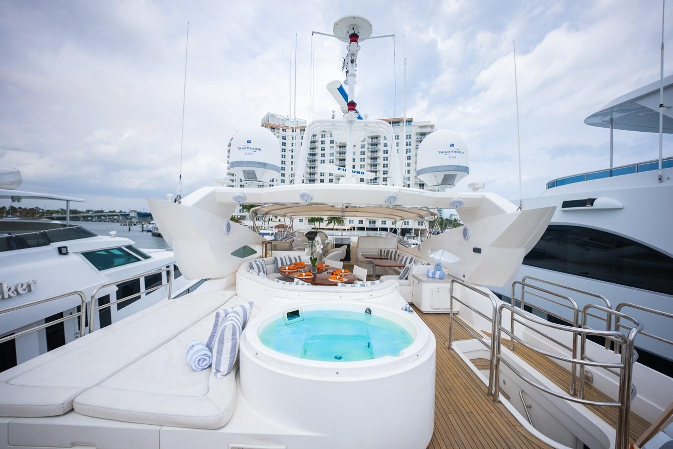 a large white boat with a blue water fountain in front of it aboard 105 MOTOR Yacht for Sale