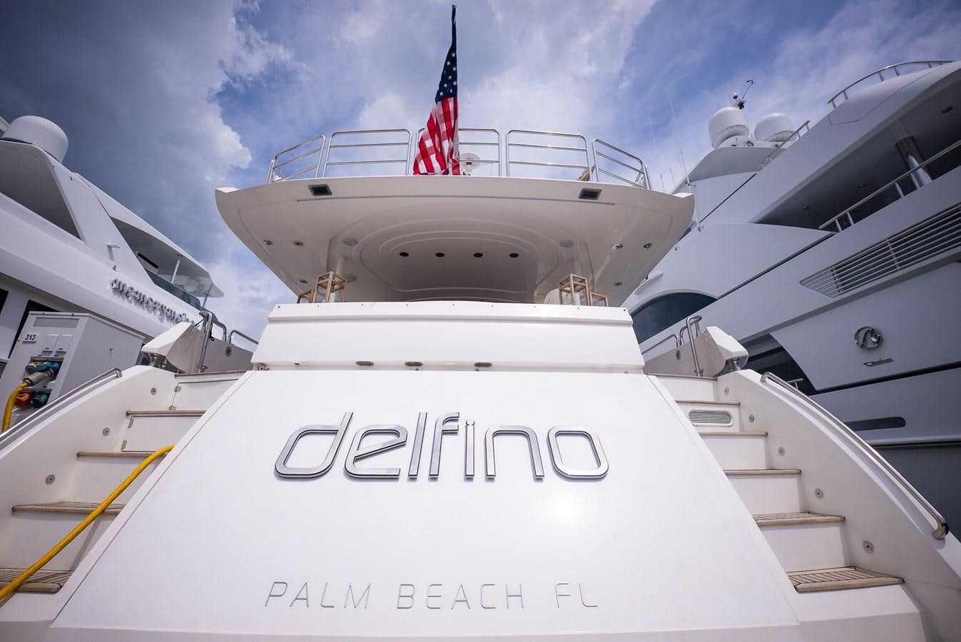 a large white ship with a flag on top aboard 105 MOTOR Yacht for Sale