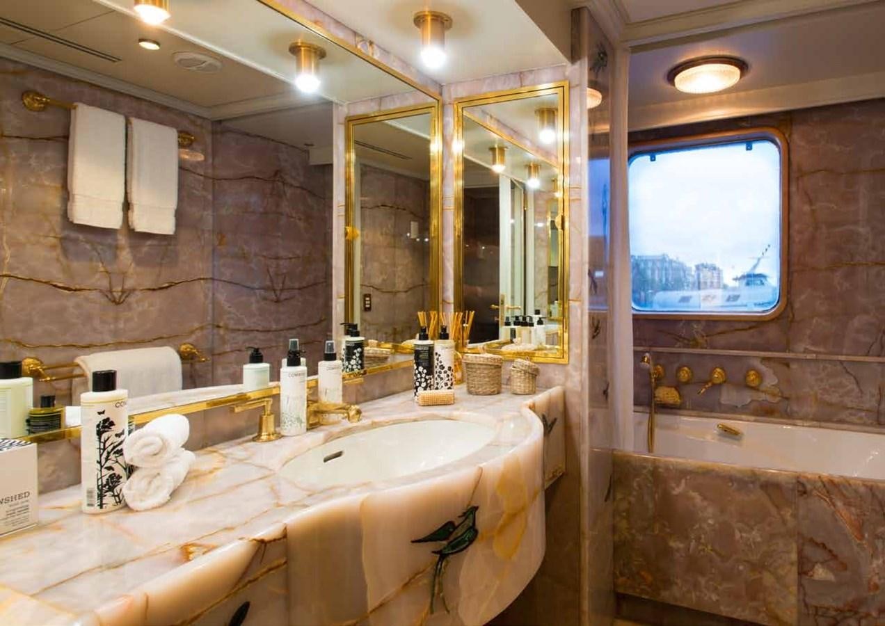 a bathroom with a large mirror aboard SANOO Yacht for Sale