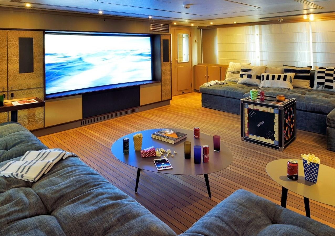 a living room with a large screen aboard SANOO Yacht for Sale