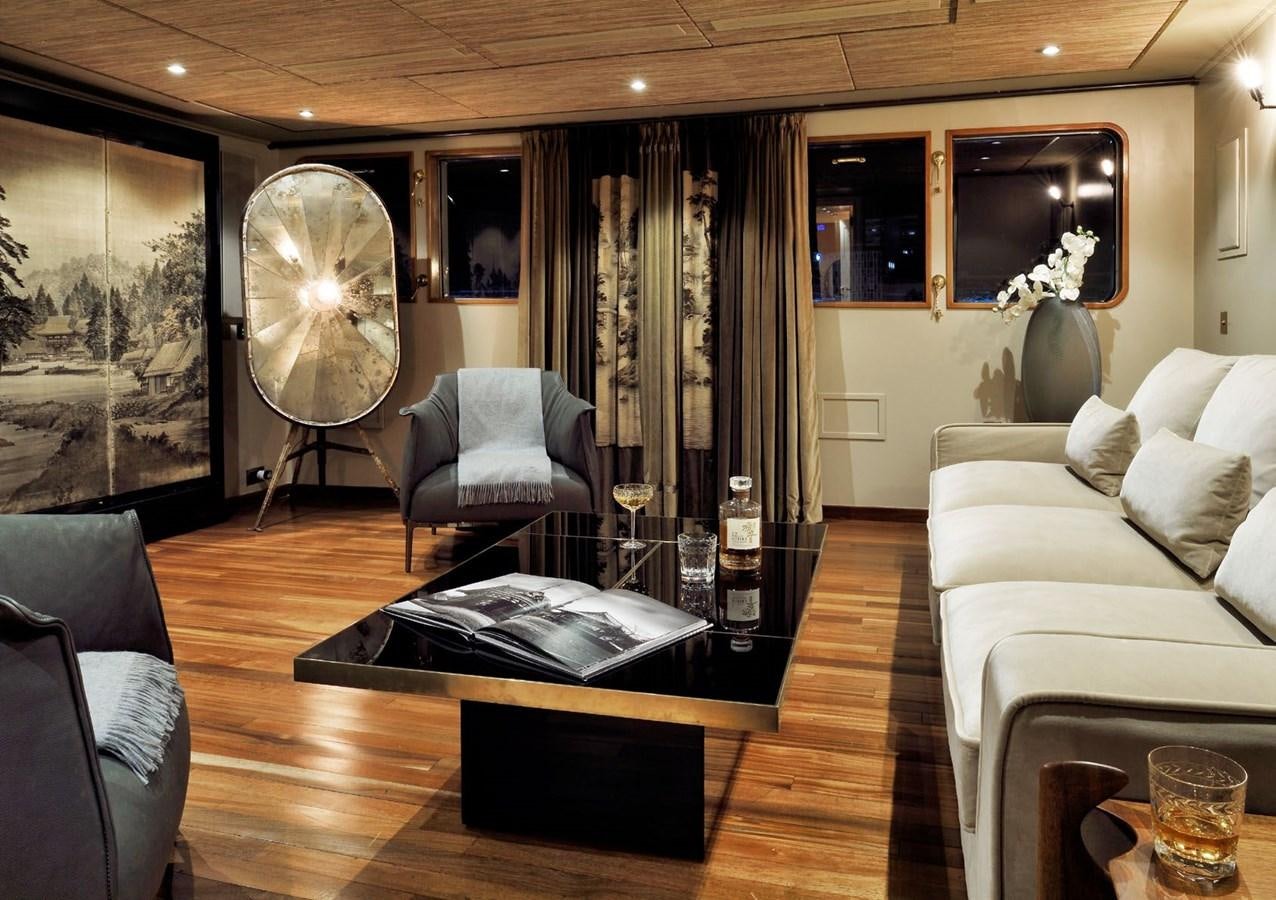 a living room with a large mirror aboard SANOO Yacht for Sale