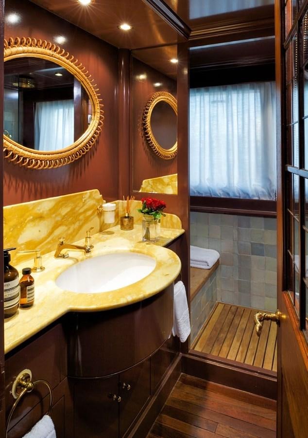 a bathroom with a sink and a mirror aboard SANOO Yacht for Sale