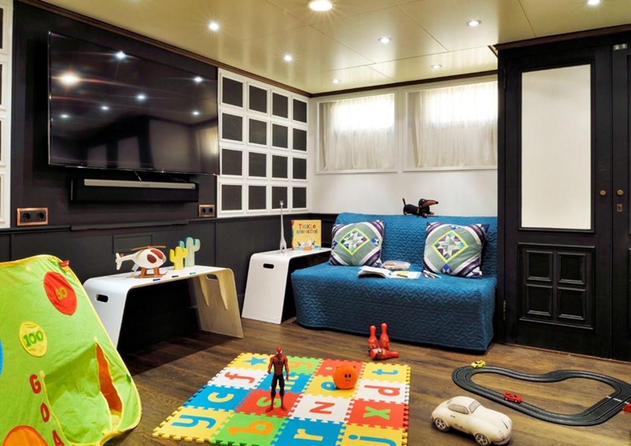 a room with a couch and a table and a bed aboard SANOO Yacht for Sale