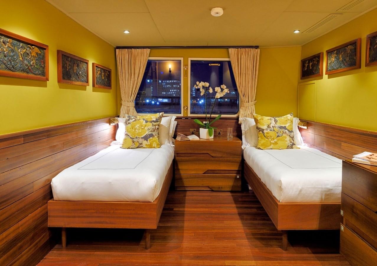 a living room with a wood floor aboard SANOO Yacht for Sale