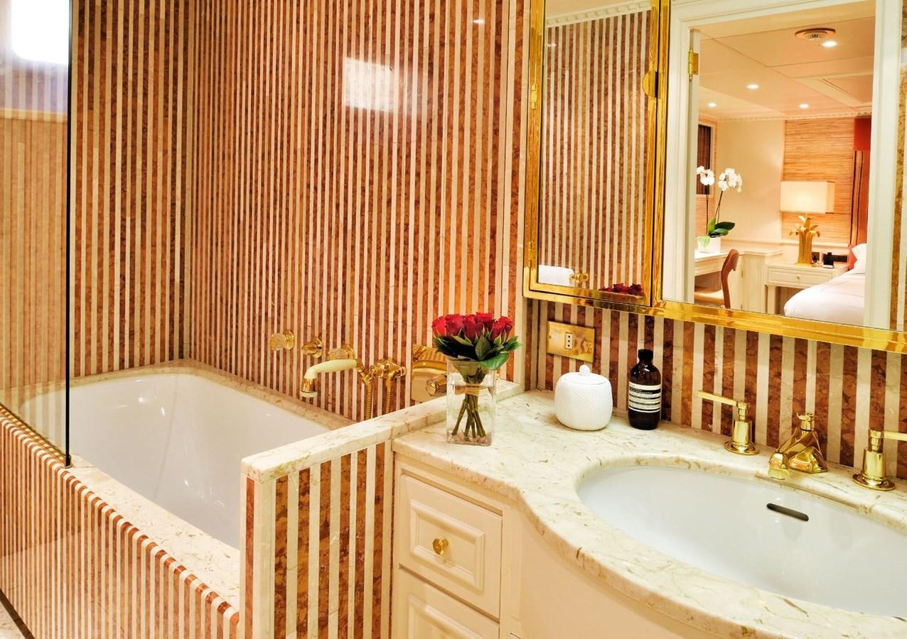 a bathroom with a sink and bathtub aboard SANOO Yacht for Sale