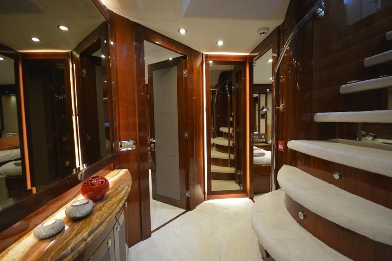 a room with a bed and a mirror aboard SUNSEEKER 34M Yacht for Sale