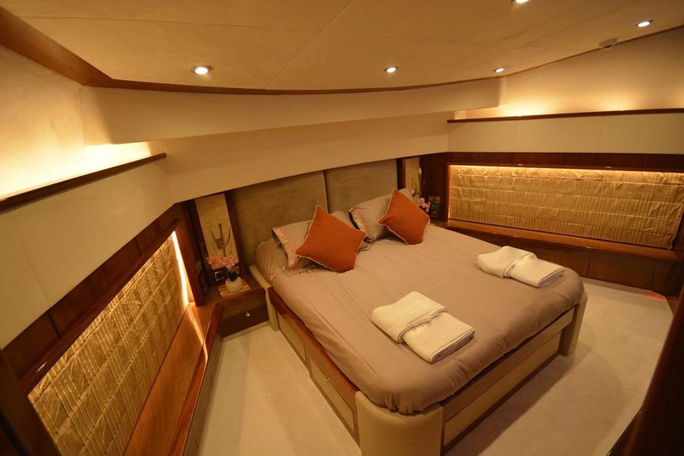 a room with a bed and a table aboard SUNSEEKER 34M Yacht for Sale