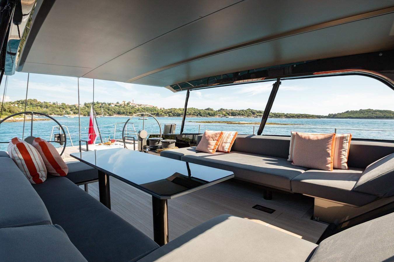 a boat with pillows on a deck aboard WHIMSEA Yacht for Sale