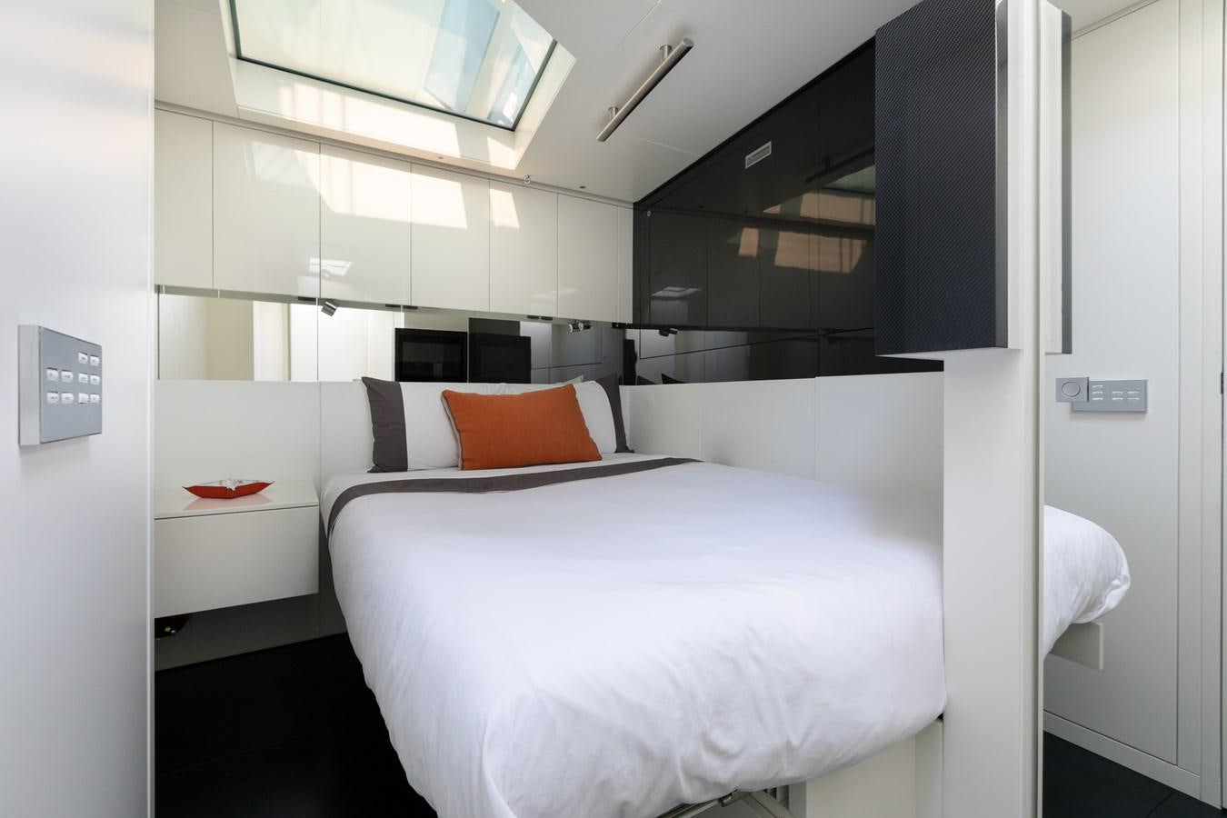 a room with a bed and a pillow aboard WHIMSEA Yacht for Sale