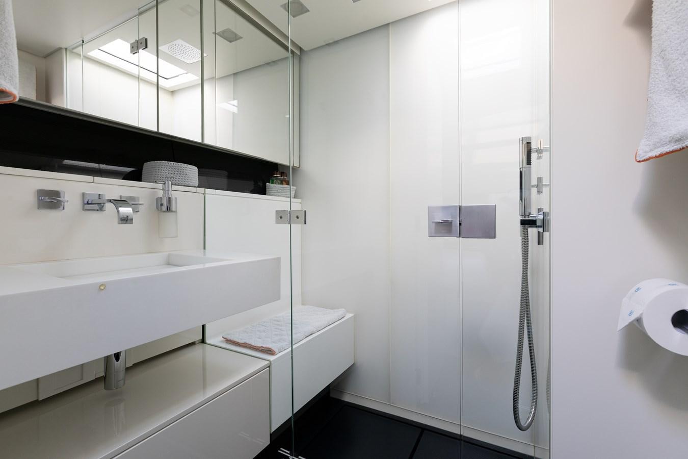 a bathroom with a sink and a mirror aboard WHIMSEA Yacht for Sale