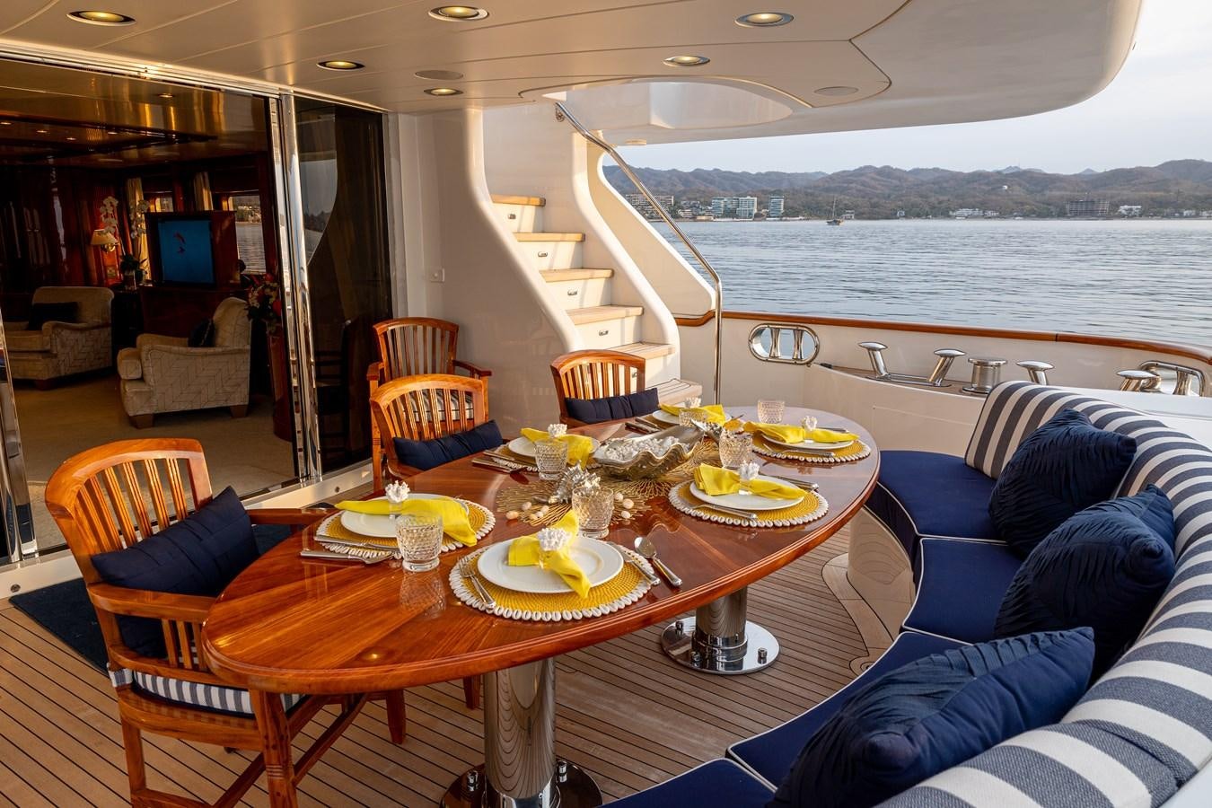 a table with plates and food on it aboard FELICITA Yacht for Sale