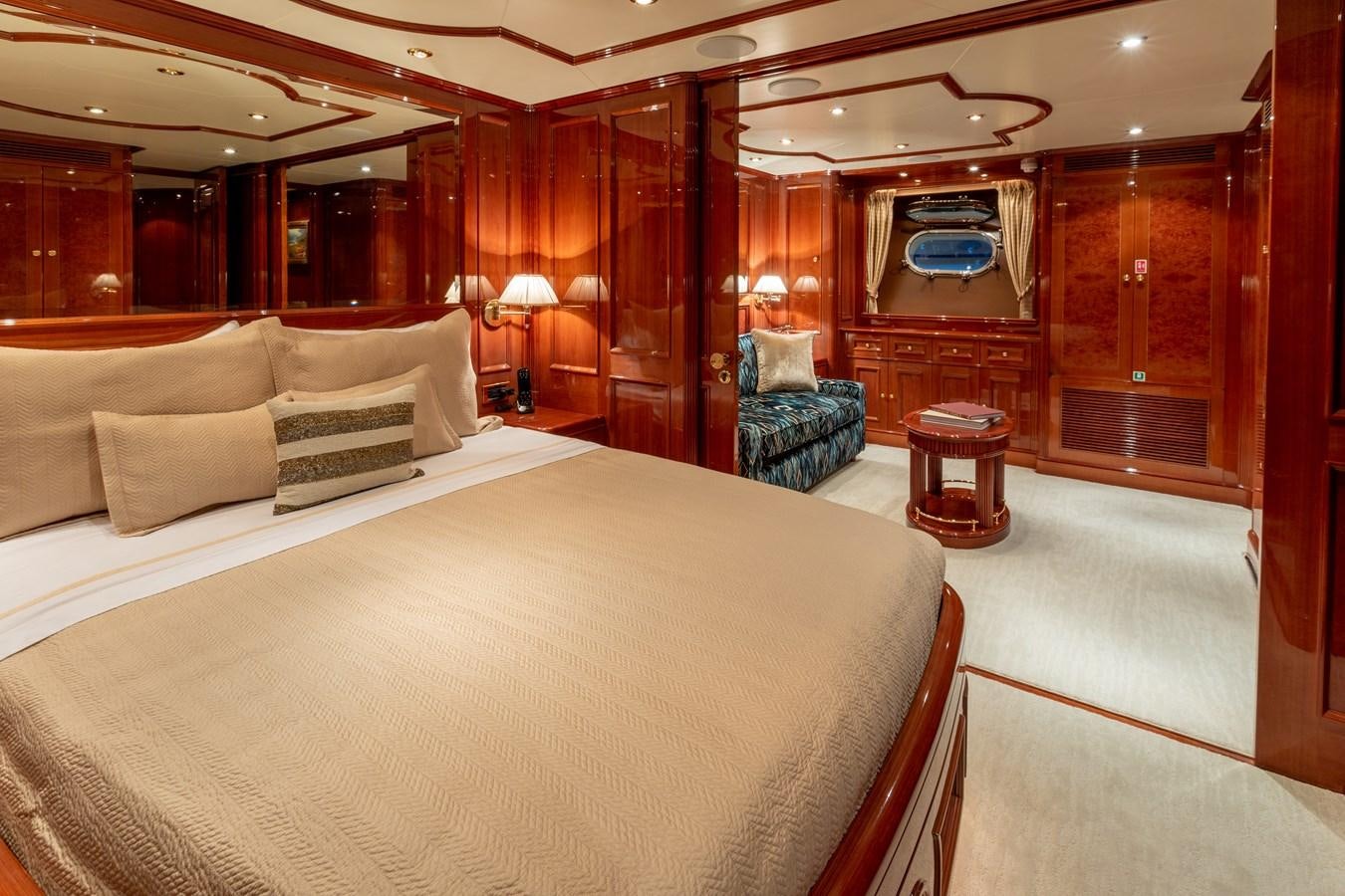 a room with a bed and a chair aboard FELICITA Yacht for Sale