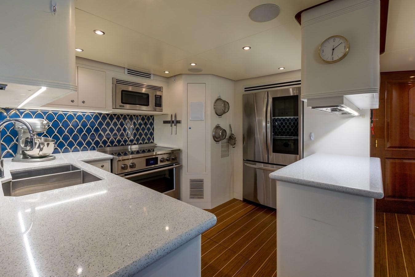 a kitchen with a sink and stove aboard FELICITA Yacht for Sale