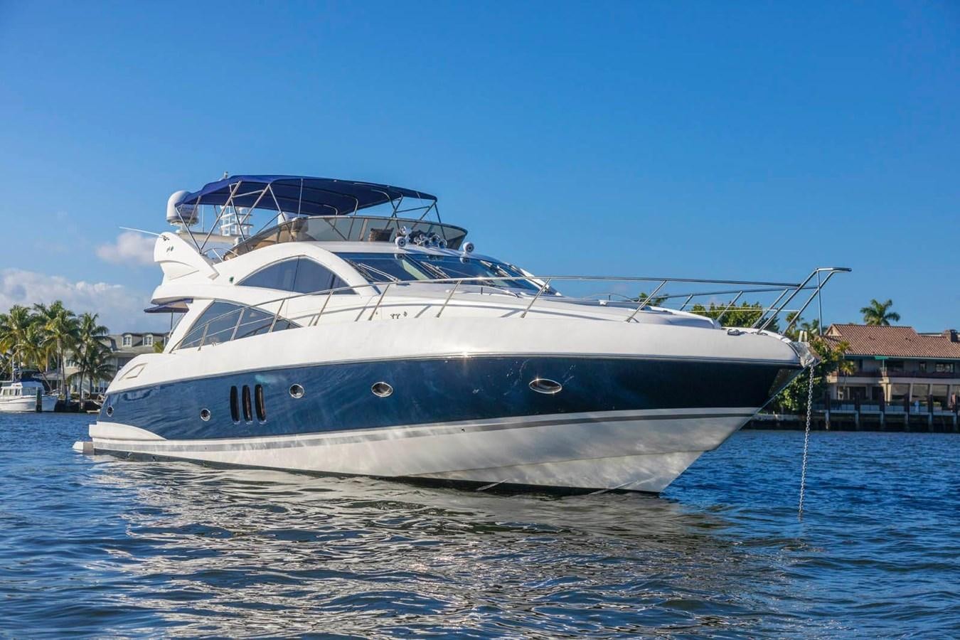 a white boat in the water aboard UNFORGETTABLE Yacht for Sale