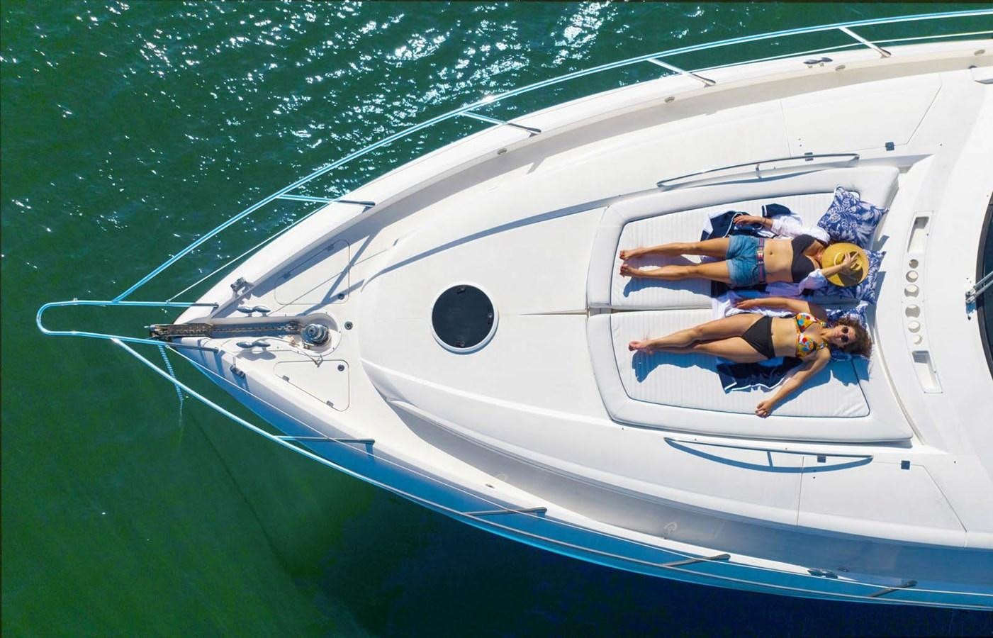 a man and woman on a boat aboard UNFORGETTABLE Yacht for Sale