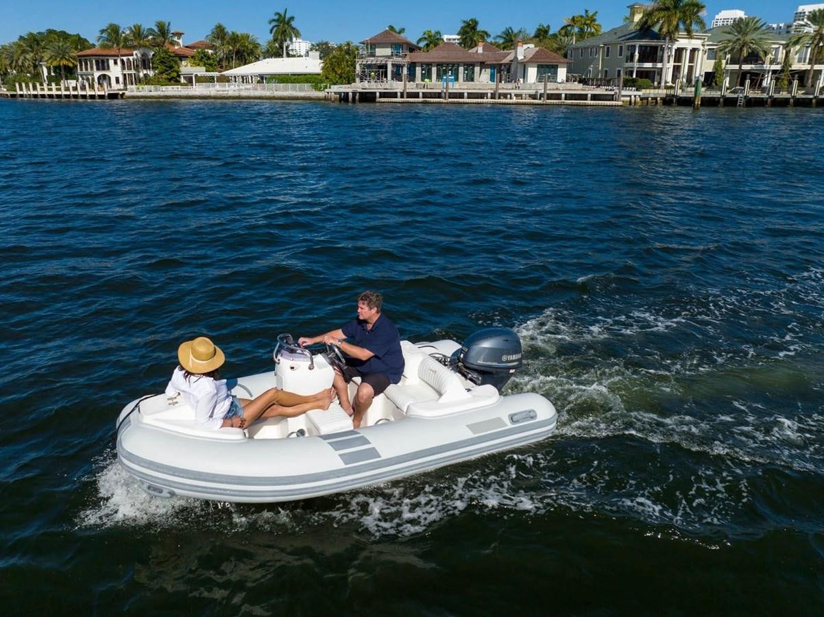 a person in a white boat aboard UNFORGETTABLE Yacht for Sale