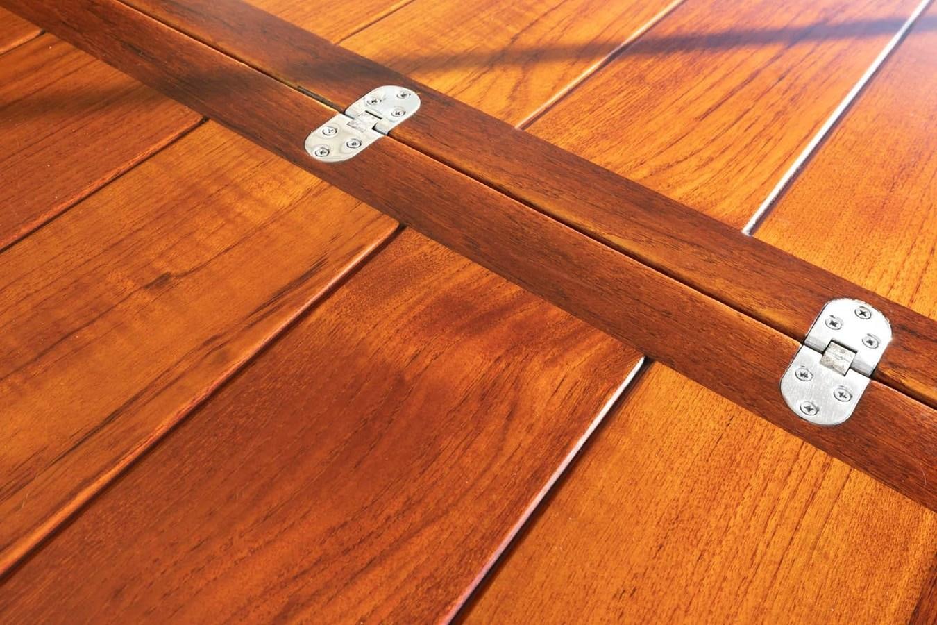 a wooden table with a few dice aboard UNFORGETTABLE Yacht for Sale