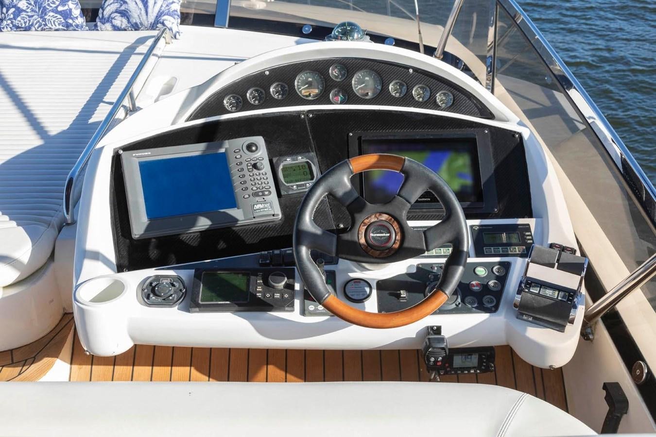 the inside of a car aboard UNFORGETTABLE Yacht for Sale