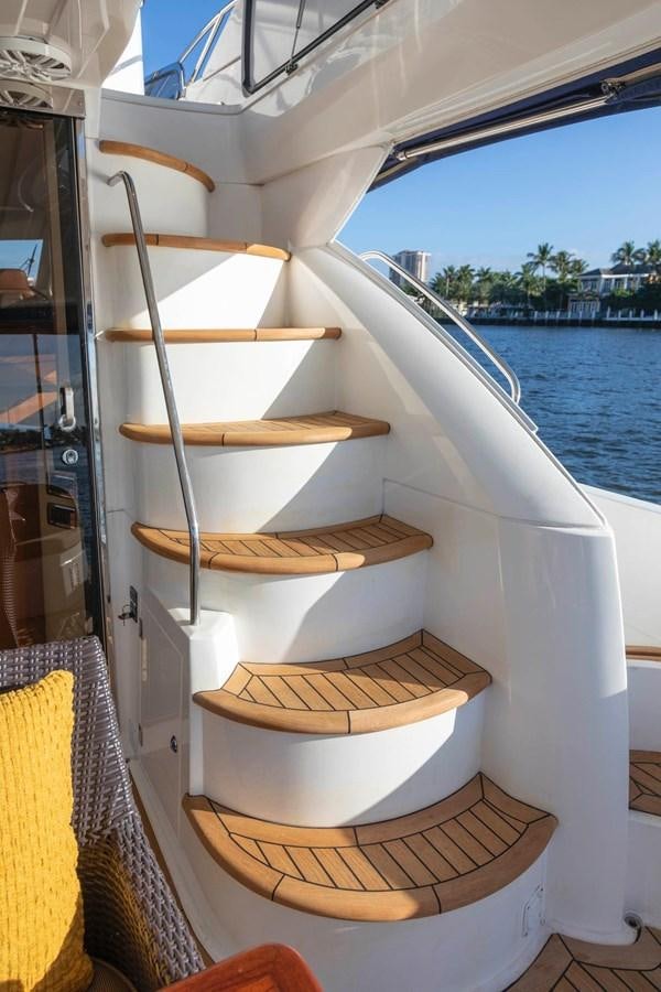 a boat with wood planks on it aboard UNFORGETTABLE Yacht for Sale