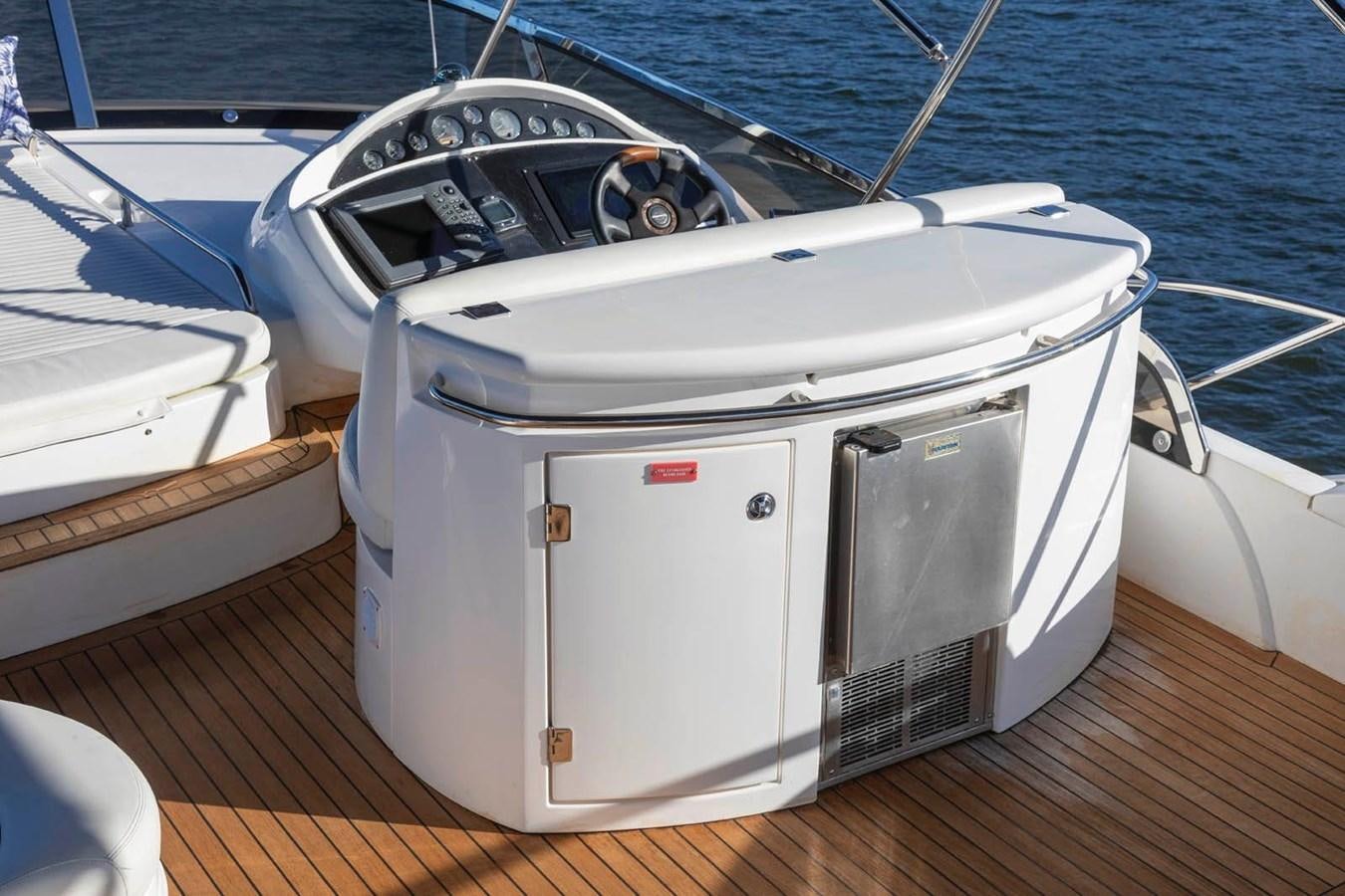 a white boat on a dock aboard UNFORGETTABLE Yacht for Sale