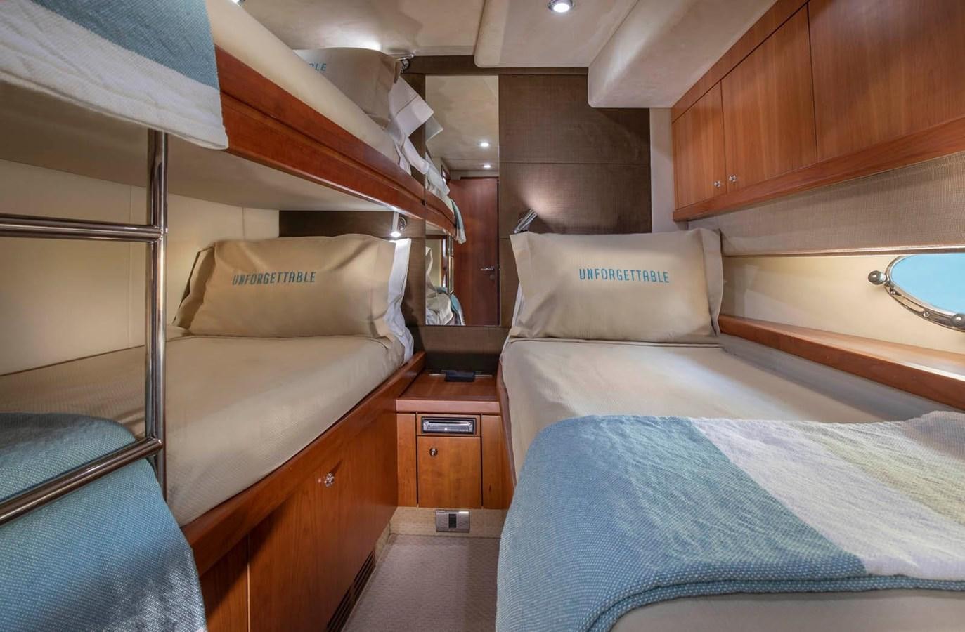 a bed with a couple of beds aboard UNFORGETTABLE Yacht for Sale