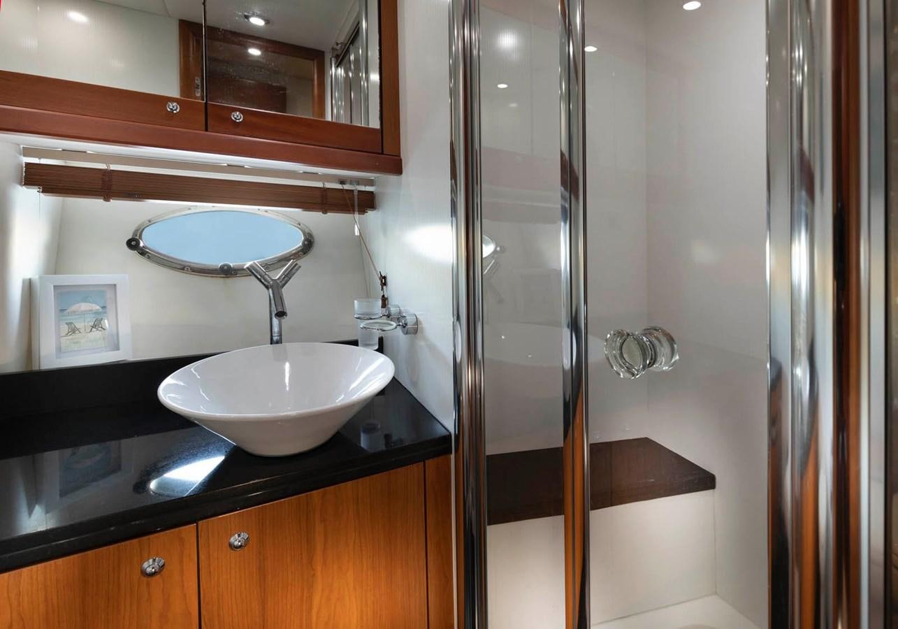 a bathroom with a sink and a shower aboard UNFORGETTABLE Yacht for Sale