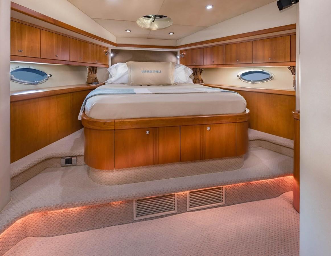 a bed in a room aboard UNFORGETTABLE Yacht for Sale