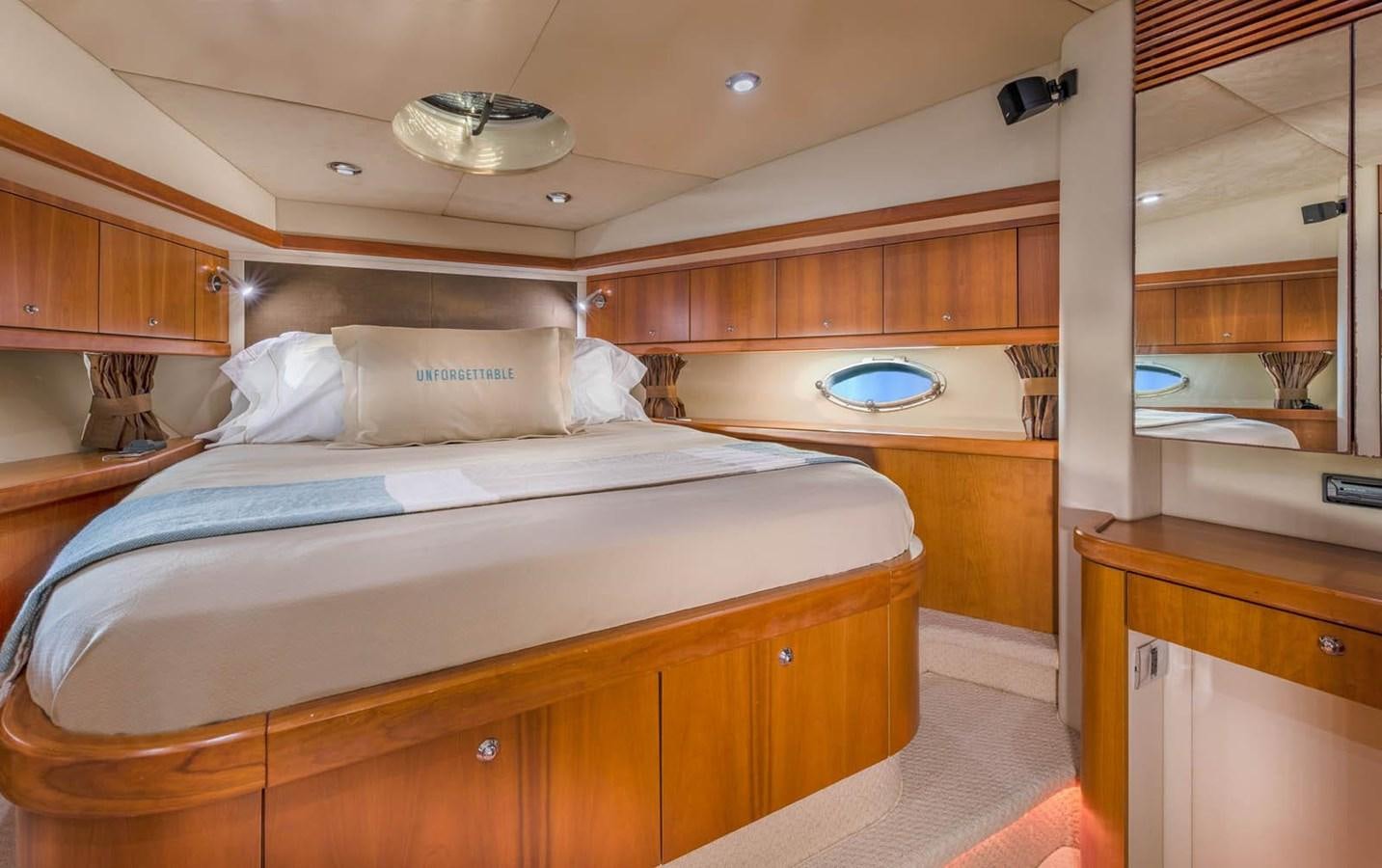a room with a bed and a sink aboard UNFORGETTABLE Yacht for Sale