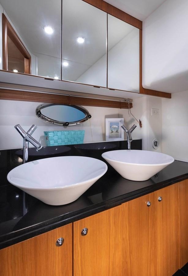 a bathroom with two sinks aboard UNFORGETTABLE Yacht for Sale