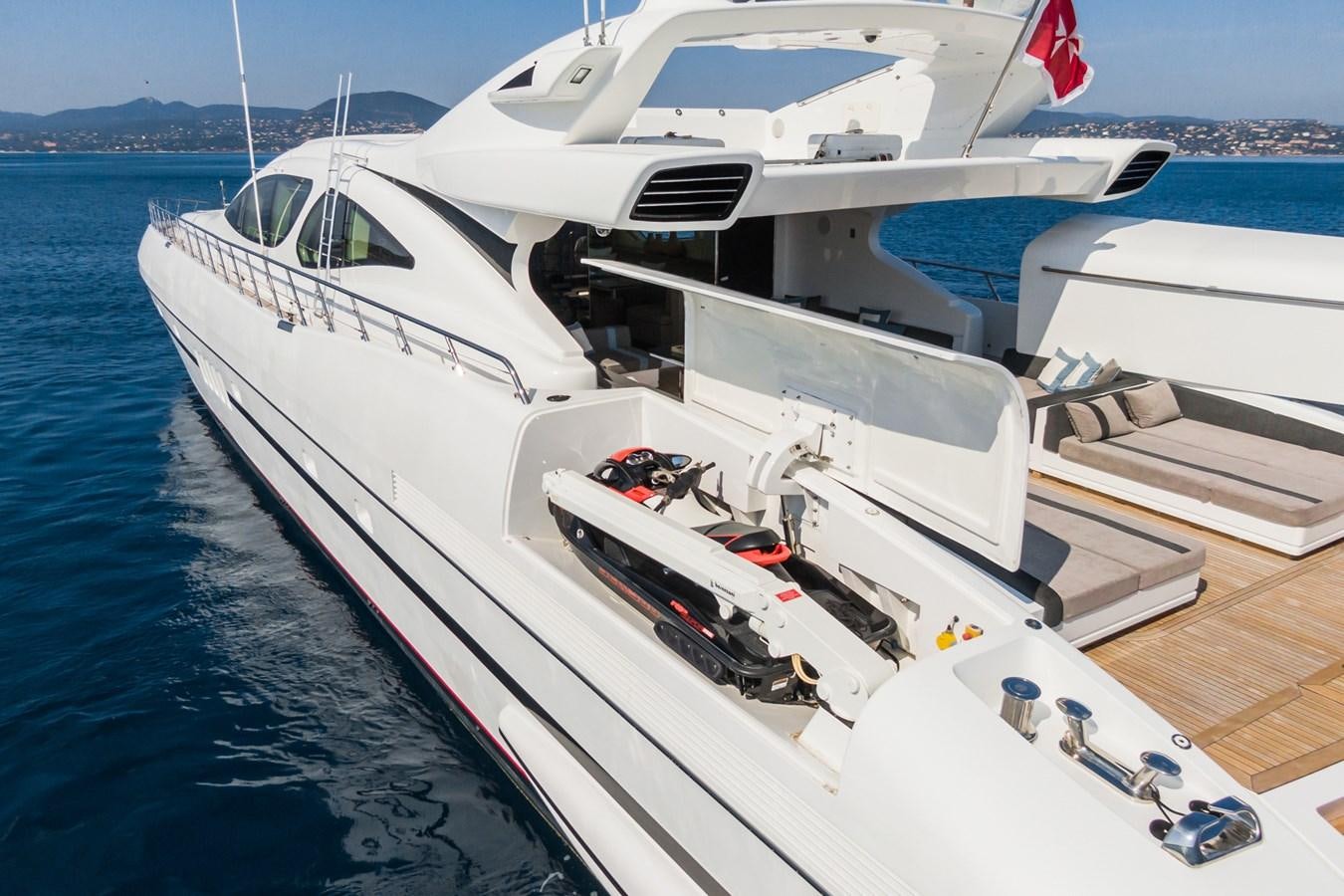 a boat docked at a pier aboard MANGUSTA 130 Yacht for Sale