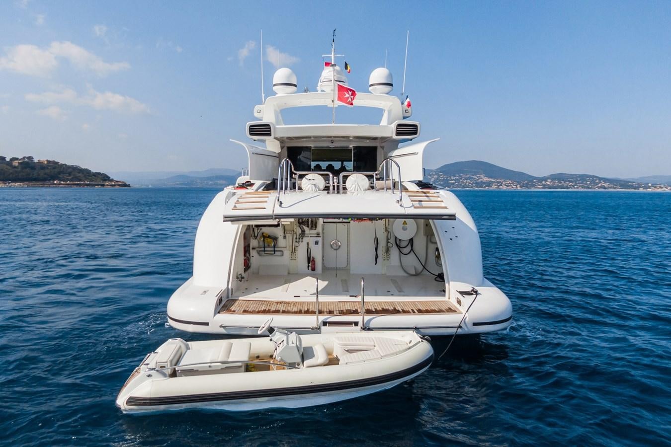 a boat in the water aboard MANGUSTA 130 Yacht for Sale