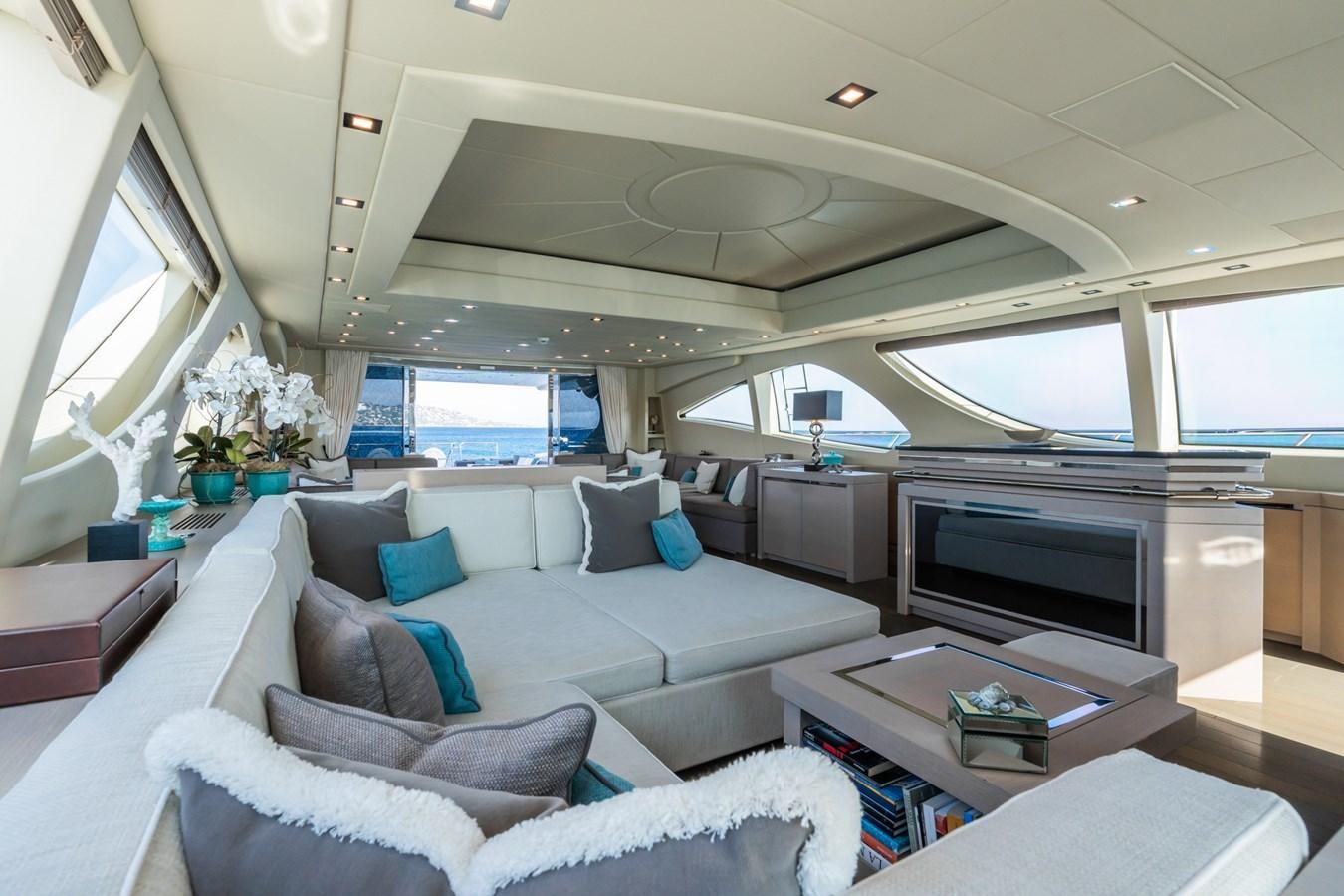 a living room with a large window aboard MANGUSTA 130 Yacht for Sale