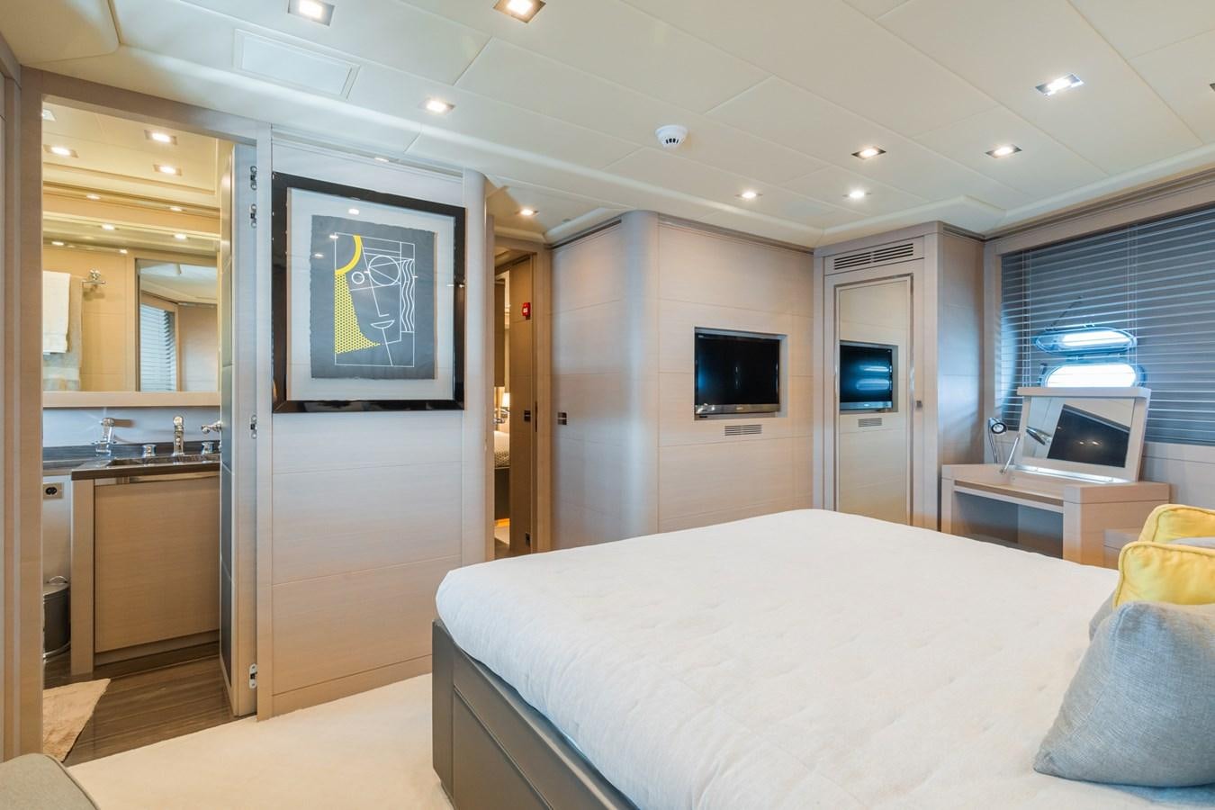 a bedroom with a bed and a tv aboard MANGUSTA 130 Yacht for Sale