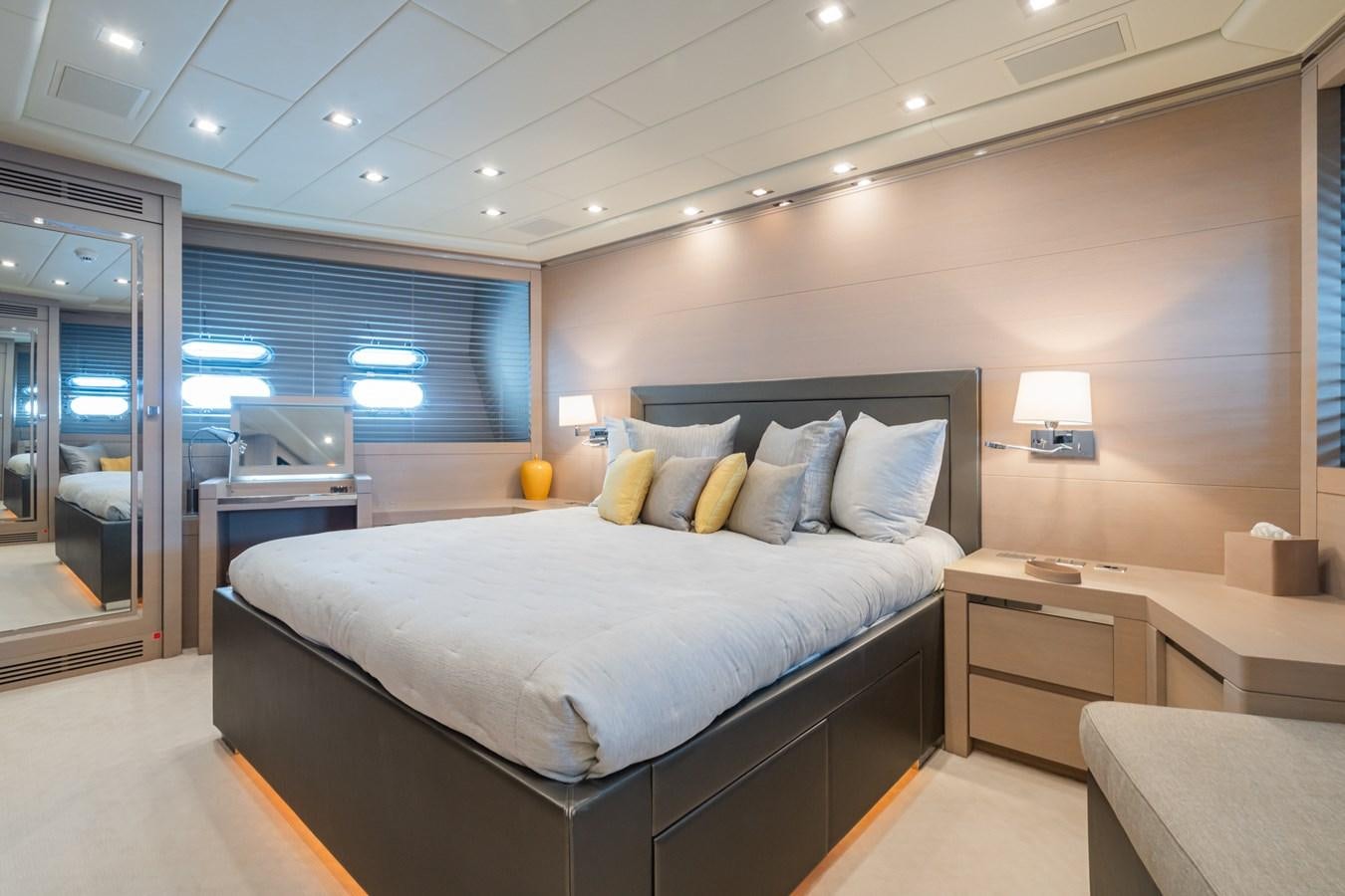 a large bedroom with a bed aboard MANGUSTA 130 Yacht for Sale
