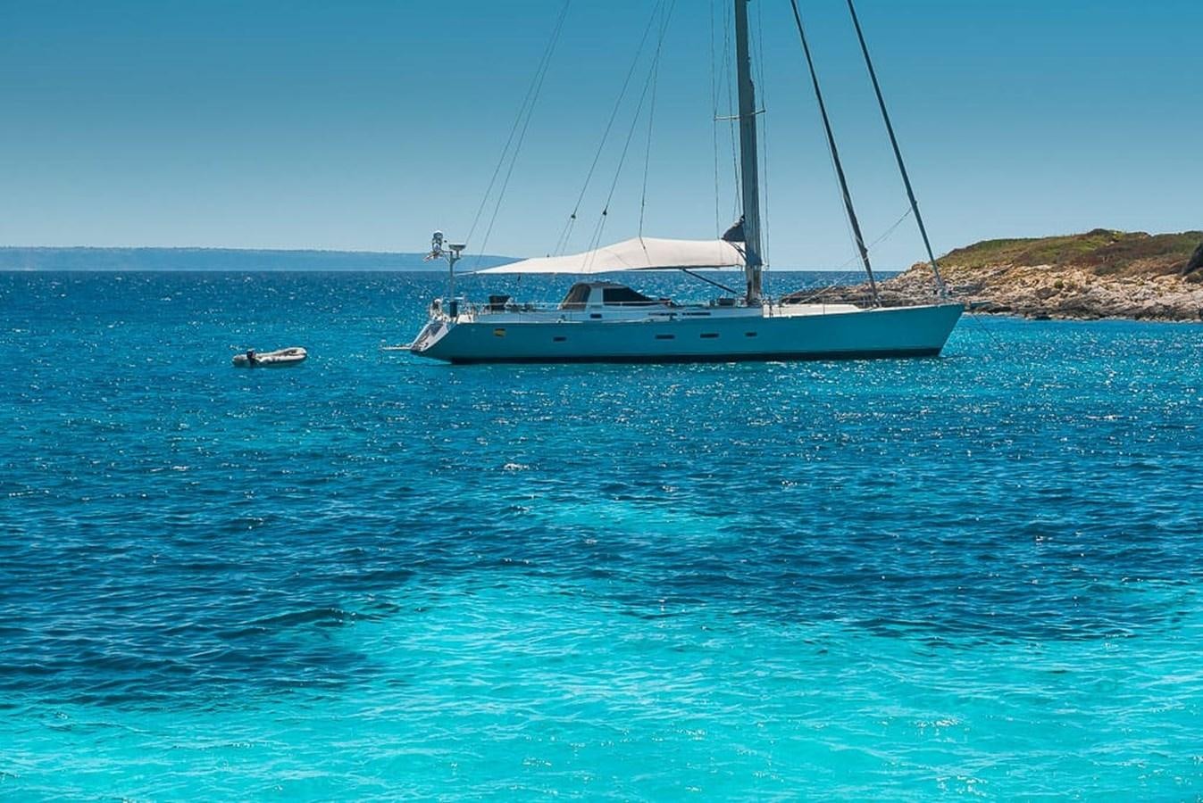 a boat sailing in the sea aboard OCEAN PHOENIX Yacht for Sale