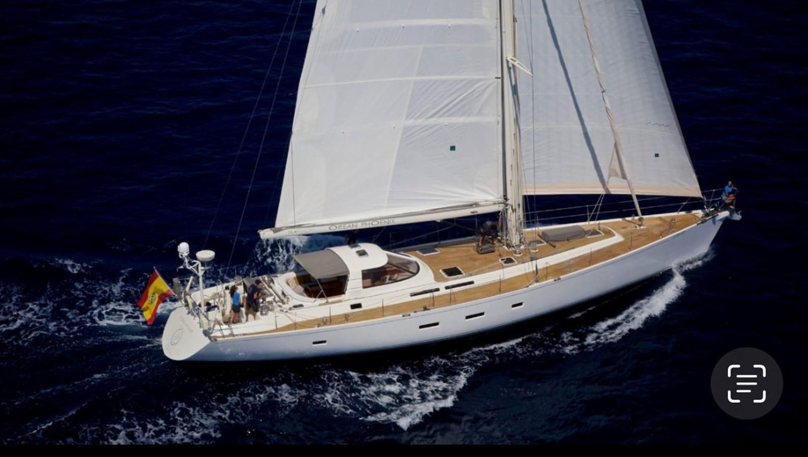 a white sailboat on the water aboard OCEAN PHOENIX Yacht for Sale