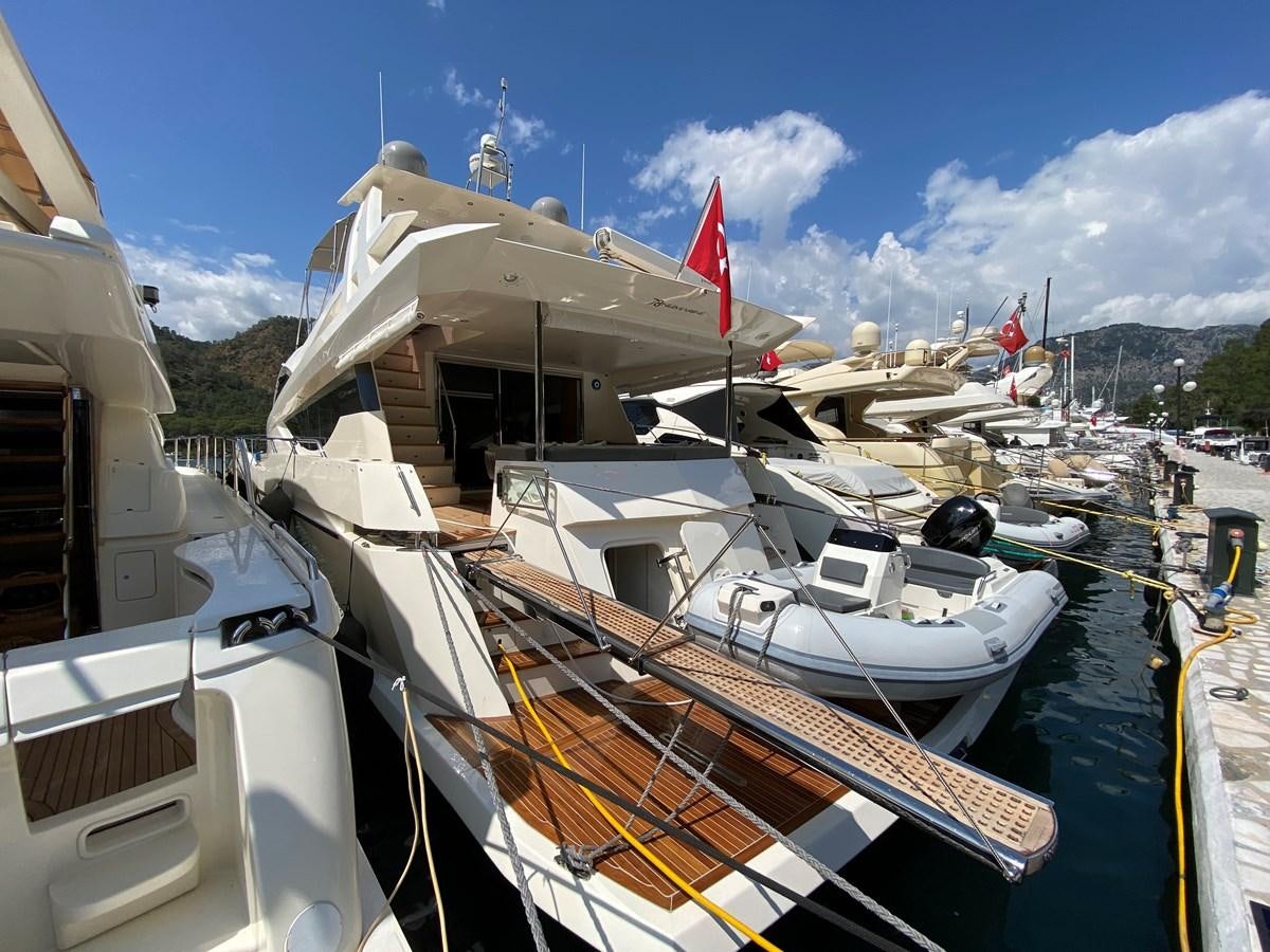 a boat docked at a pier aboard MR CORN Yacht for Sale