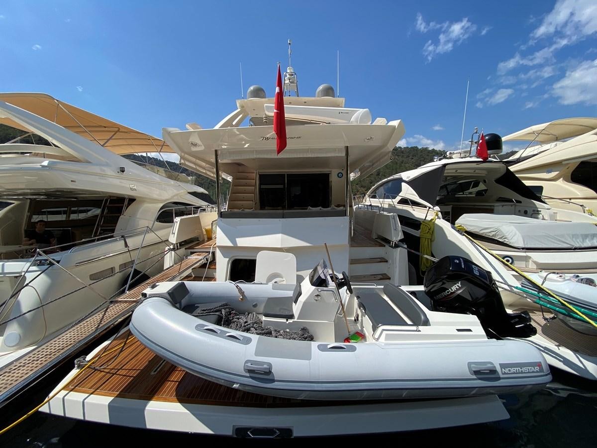 a boat docked at a pier aboard MR CORN Yacht for Sale