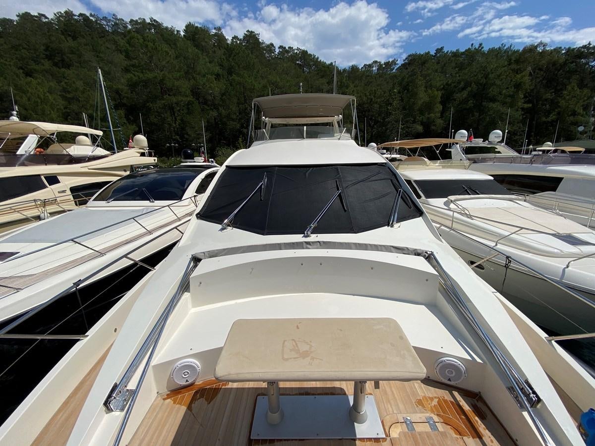 a group of boats in a harbor aboard MR CORN Yacht for Sale