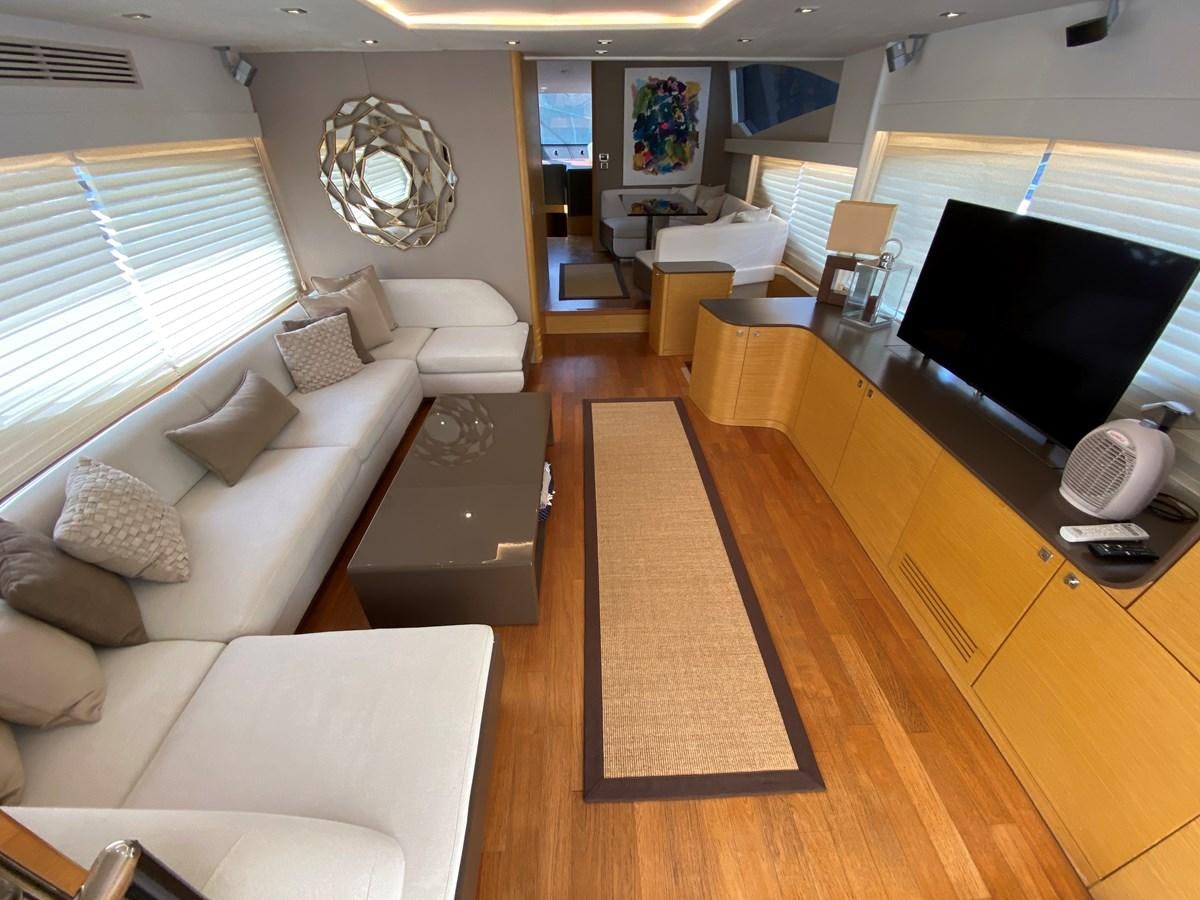 a living room with a large tv aboard MR CORN Yacht for Sale