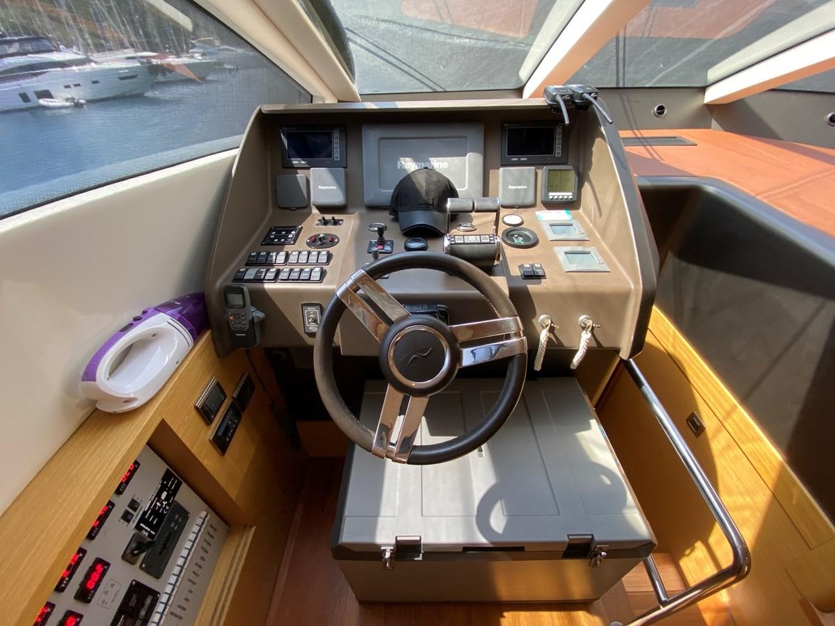 a car inside a car aboard MR CORN Yacht for Sale