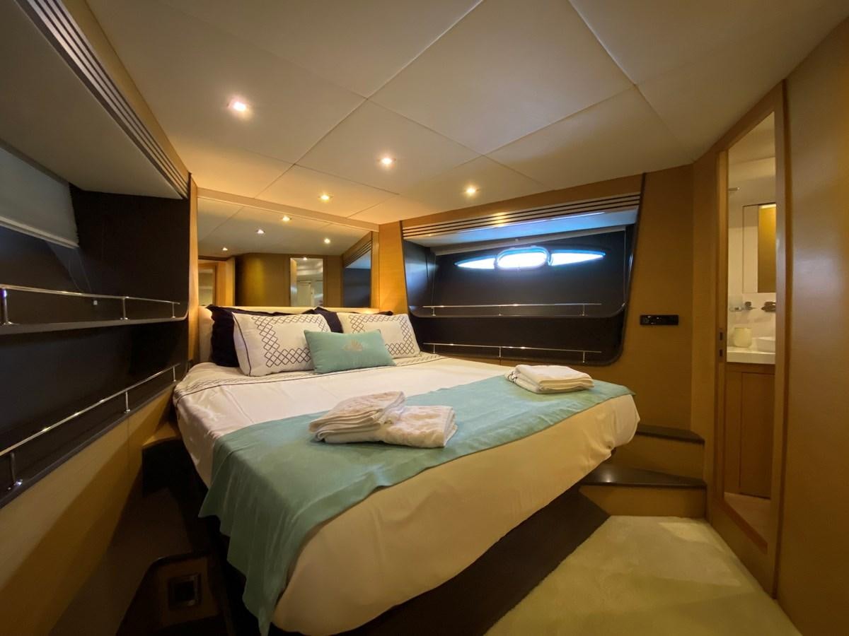 a bed in a room aboard MR CORN Yacht for Sale
